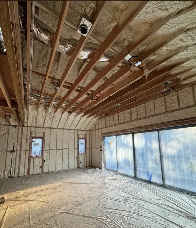 Interior walls and ceiling insulated with spray foam during new construction in Germantown